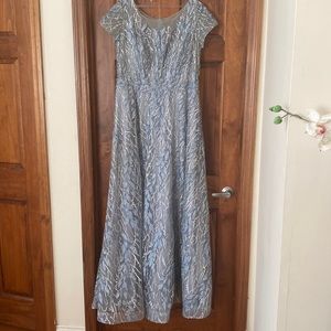 An icy blue, short sleeve and beaded a line gown.